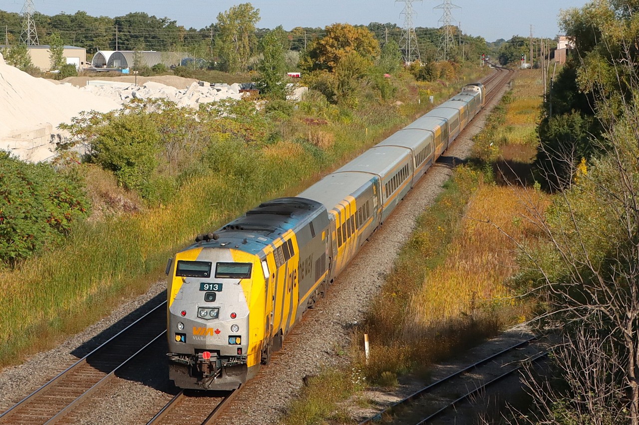 V70 with VIA 909 leading and VIA 913 pushing with a Clear Signal at Tansley, in the distance V97 "Amtrak Maple Leaf" waits on the east side. Planned work on the Metrolinx portion of the Oakville Sub. has VIA trains detouring the back way utilizing the freight only portion of the Halton Sub. as part of their routing.