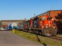 Went out this night for the first time in a while. It was a nice night, and the days are getting ever shorter, so I figured what the heck. Soon after, I hear 581 talking to the 1600 about needing to get in the clear, which certainly piqued my interest. Immediately, I wondered if they were at Hooper, a place known for some interesting loads (example <a href="https://www.railpictures.ca/?attachment_id=51240" target="_blank">here</a>
and <a href="https://www.railpictures.ca/?attachment_id=50944" target="_blank">here</a>). <br><br>Sure enough, they soon appeared out of the Eastport area with a D9 dimensional and a convoy of trucks following them - including CN and even a PR firm documenting the move. I'd soon come to learn this was a test move, with the goal to get it out on the Grimsby and up to 35mph before taking it back down the N&NW and back to Hooper. I am under the impression the test was to see how the load itself responded to being moved. Sounds like they have shipped it other ways, and are also building another model with different materials to see how it responds (including to drop tests). The load itself is from Westinghouse - and I have no idea what it is but am suspecting it may be a mini reactor of sorts. Curious if anyone knows. <br><br>Chased it but this was the only photo I got. The shadows far too long at the time of day for any other location to work. Was fun nonetheless and got to learn a lot from the people who were being paid to follow it.