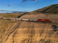 CPKC 301-492 climbs out of Walhachin toward Semlin with 112 loads of grain for the coast. 

CPKC 301-492: CP 8840, KCSM 4543 - DP 1x0x1 - 112 cars