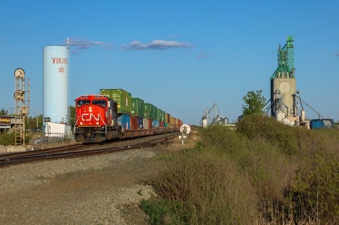 CN Q 11991 13 highballs through Viking with recently rebuilt CN 8326.