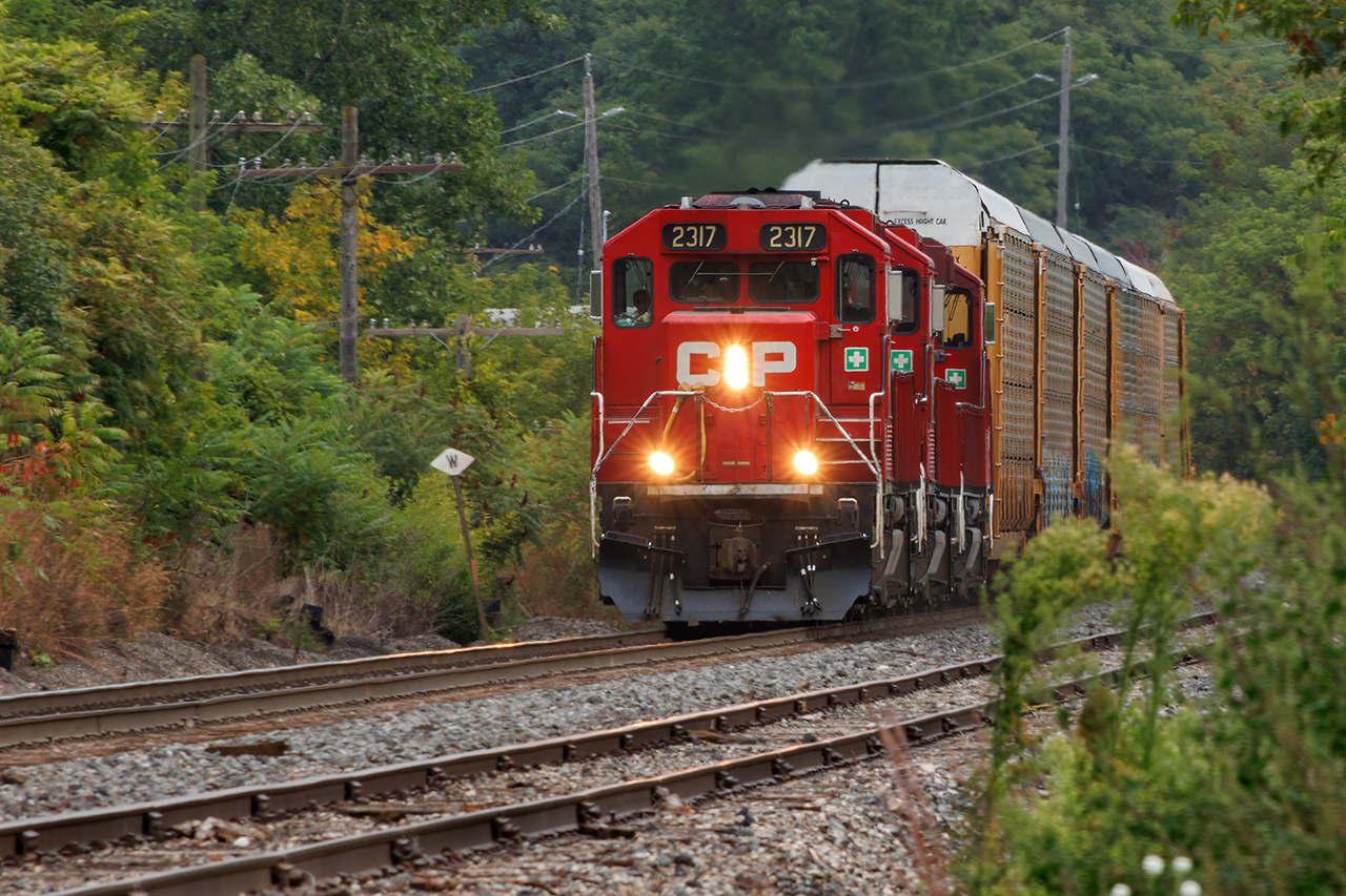 My disdain for how ugly GP20's are has been stated often. However, on those rare occasions when a bunch get together, dragging 6000+ feet of empty racks to clean out Toronto, they do display the narrow-cab appeal that I miss so much from the old days. Sure, they're hideous, but from this angle, it could just as easily be 3 GP35's...OK, maybe I'm pushing it a bit, but I'm really glad I went out for them.