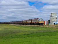 The Royal Canadian Pacific has conquered Crowsnest Pass and cruises through Pincher Station enroute to Kipp Yard in Lethbridge. 
