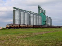 The Royal Canadian Pacific eases past the elevator at Blackie, as they prepare to protect the highway crossing in town. 