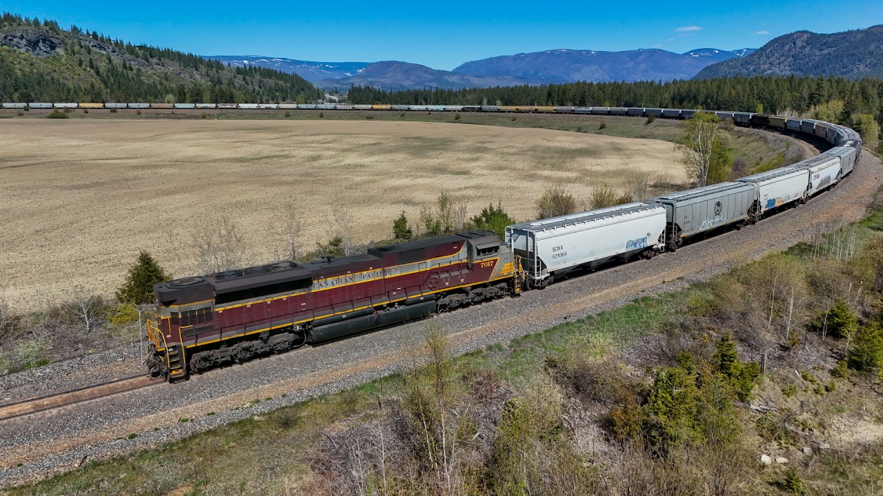 CP 7017 shoves CPKC 303-662 around the horseshoe curve at Notch Hill.