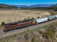 CP 7017 shoves CPKC 303-662 around the horseshoe curve at Notch Hill. 