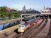 The Parliament Buildings loom over the early morning scene at Ottawa Union Station, as the first section of the <i>"Dominion"</i> pauses before departing for Montreal.  Shortly before this scene, the train was photographed <a href=https://www.railpictures.ca/?attachment_id=57136>having just crossed the Alexandra bridge.</a>

<br><br><i>Scan and editing by Jacob Patterson.</i>