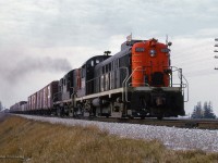 Just east of <a href=https://www.trha.ca/trha/history/stations/pickering-station/>CN's Pickering station,</a> a pair of MLW units (rs3/rs10) fly eastbound on the point of an extra freight.

<br><br><i>Scan and editing by Jacob Patterson.</i>