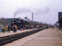 Crowds gather on the platforms at CPR's West Toronto station for the arrival of Ontario Rail's ex-CPR D10 1057.  The excursion to Orangeville on this overcast Saturday was to mark the 100th anniversary of Brampton's incorporation as a town (village, 1853; town, 1873; city, 1974.)

<br><br><i>Scan and editing by Jacob Patterson.</i>