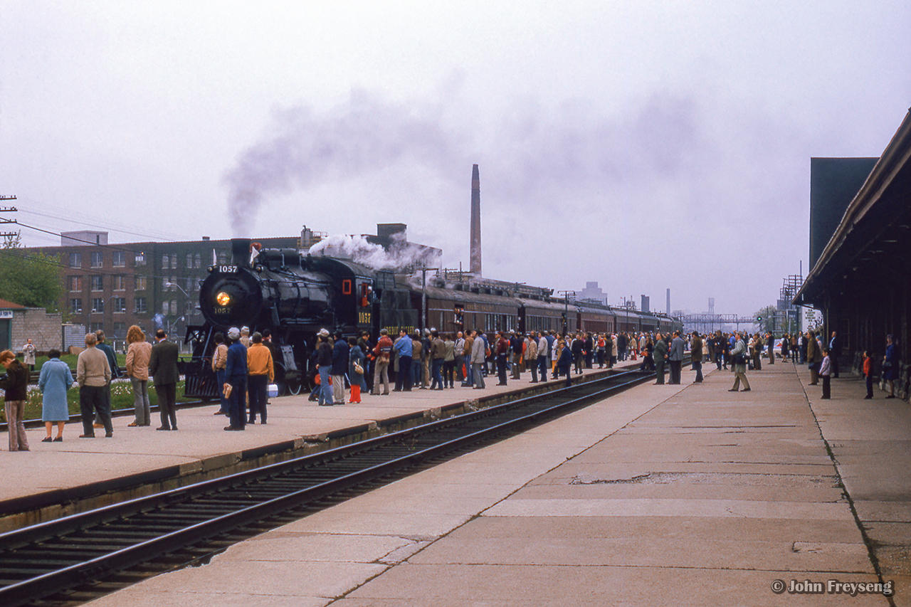 Crowds gather on the platforms at CPR's West Toronto station for the arrival of Ontario Rail's ex-CPR D10 1057.  The excursion to Orangeville on this overcast Saturday was to mark the 100th anniversary of Brampton's incorporation as a town (village, 1853; town, 1873; city, 1974.)

Scan and editing by Jacob Patterson.