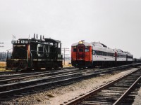 An extra wayfreight works the yard at Ingersoll while a set of eastbound Budd cars pass by on the main.

<br><br><i>John Freyseng Photo, Jacob Patterson Collection Slide.</i>