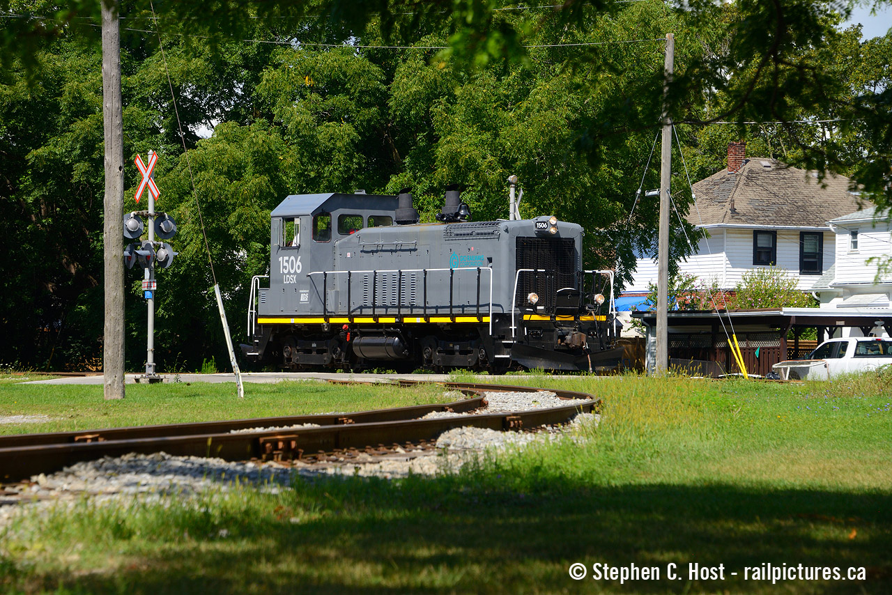 CN 1506 had an interesting journey to get to the Niagara region. First sold to K&K in a CN auction in October 2020. Moved to Welland in early 2021 with a grab bag of other Dash 8 locomotives, they sat unprotected at the former Martech facility where nobody really kept the fence closed. Presumably they were for scrap, but K&K is also in the re-sale business. There were plans to re-sell locomotives overseas, but vandals would get to the locomotives and take out all the copper wiring and anything else of immediate scrap value rendering just about every locomotive stored in Niagara useless for re-sale. However, the three four axle units, 4100, 1504, 1506 while vandalized were kept around after all the Dash 8's were dismantled in 2021/2. Sold to Lambton Diesel who rose to the challenge, the units were completely rewired and rebuilt, even with new prime movers (replacing the B-C blocks with C blocks) 1506 was modified with new cut-in long hood windows to compliment the small portal windows to improve visibility. 1506 now toils in active service daily for the GIO Railway in Niagara, not too far from where it was stripped and left for dead, only to rise from the scrap heap to live another life. Great job to the LDSX folks for showing us how it can be done.
Pictured is the daily Flour Mill switcher heading back to the mill to switch some cars on the former CNR Dunville sub, with the Government Spur in the foreground.