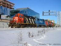 CN 568 is passing Google's Canadian HQ with a 1950's built GP9 in the lead on a beautiful winter's day. Talk about a contrast in technologies.