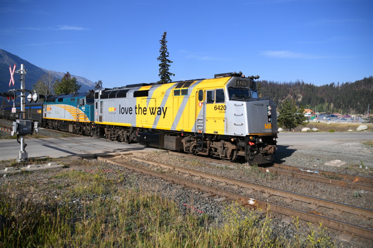 Next stop Jasper  
VIA 002 'The Canadian' crosses Hazel Avenue at the west end of CN's Jasper yard and is about to take the turnout onto the station track putting the consist right next to the platform when it comes to a stop. 
Today's Canadian would not depart the station in normal fashion due to major reconstruction work by CN at the east end of the yard. VIA 002 would make a reverse movement from the station track, out onto CN's Albreda Sub. to CN Home at Mile 0.5 before proceeding on its journey east. 
Pic to follow. :-)