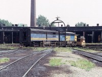 Via Rail MLW locomotive FP4A 6789 leads MLW FPB4 6867 onto the turntable at the old Via roundhouse on a hot summer day in August of 1983, back when roundhouses were still a thing. All of this is changed nowadays, although I am told you can visit a great museum and get food and ale at the former CP John Street location. Note the sign stating, "All units must stop before coming on turntable.' They indeed did stop on that day, way back when.