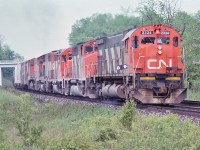 <br>
<br>
Seventies Super Power!
<br>
<br>
On the Kingston Sub-Division
<br>
<br>
Five units, four models, two builders. 
<br>
<br>
MLW M-636, GP40-2LW, GP40 (renumbered into the 9300 series in 1981), GP40-2LW and MLW M-420
<br>
<br>
Westbound under the Wesleyville bridge, May 26, 1979 Kodachrome by S.Danko.
<br>
<br>
And a thank you to Nikon for producing the 135mm f2.8 lens! 
<br>
<br>
