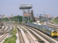 It is the 1980's in Toronto where two VIA trains have been combined after servicing most likely to run to Toronto Union Station where the two trains would be split. On this end is VIA 6217.