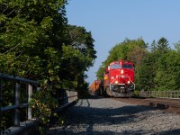 CP no.118 rolls through the neighbourhood with brand new CPKC ET44 7435 leading the way over the Yellow Creek and Balfour Ravine.