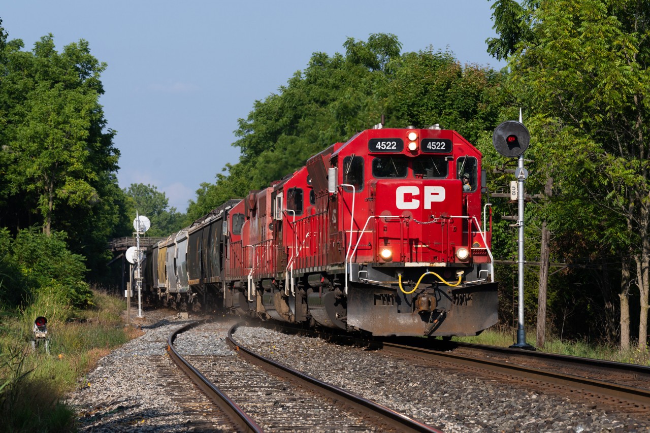 CP's Windsor Sub local bursts out of London with a three-pak of Geeps at full throttle, seen here knocking down the finial-adorned searchlight signals at the east end of Lobo siding.