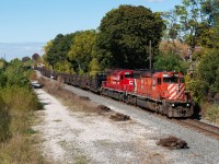 Two CP 40-2's make their way south down the Mactier Sub at John Street with a welded rail train for work on a Metrolinx project close to West Toronto...they will be dumping rail for future bridge widening and station construction over St Clair Ave on the Weston Sub. 