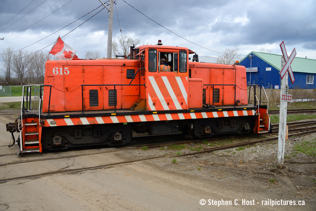 Canadian flag flying, this 80ton centrecab built 1950 numbered 615 is crossing Rusholme Road with their work done for the day. Former Stelpipe No. 7 (Mooney) which was there over 20 years, and eventually re-numbered during Universal Resource Recovery days  - 615 being the address of the facility. In 2022 or 2023 615 failed TC inspection and was parked then scrapped.  GIO/Lambton supplies locomotives here now, 108 the S13 didn't last too long and is out of service and LDSX 913 (nee WSOR) is pinch hitting for now. For Niagara guys did CN/CP both go in here before the diamond was removed in the early 2000's?