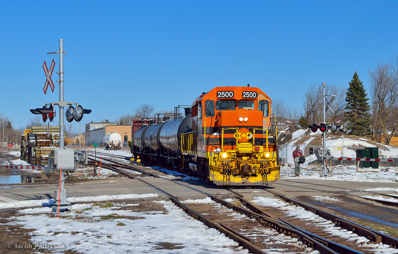 GEXR 582 makes a few late afternoon moves before departing Guelph for Preston.  The short consist is shoved into XW22 to spot a centrebeam, and shortly the crew will be homeward bound with work at FloChem.