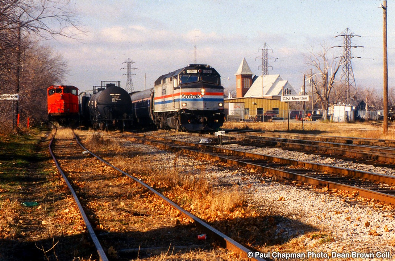 VIA 97 with AMTK F40PH-2 304 and TRRY M420 3575 in the siding at Merritton.