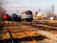 VIA 97 with AMTK F40PH-2 304 and TRRY M420 3575 in the siding at Merritton.