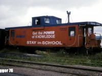 Cape Breton & Central Nova Scotia Railway (CBNS) caboose # 2000 is pictured sitting in the community of Port Hastings, which is situated on the southwestern tip of Cape Breton Island, Nova Scotia. The van was former CN 79509 and was used frequently by CBNS crews at the time. Today, photos online and a satellite view show this van still stored on CBNS property on a siding at Afton Station. 