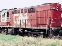 CN RS-18u 3152 passenger unit is seen here at the diesel terminal near Toronto Union Station in August of 1983, looking a bit worse for wear. Weed control was not a priority, apparently.