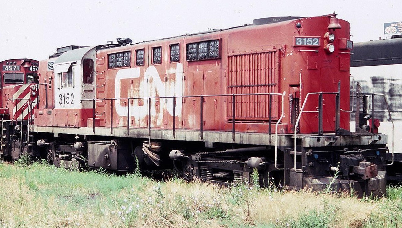 CN RS-18u 3152 passenger unit is seen here at the diesel terminal near Toronto Union Station in August of 1983, looking a bit worse for wear. Weed control was not a priority, apparently.