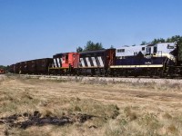 A unit train was just entering the connecting track which will take the empties across Hwy.28 and then connect to the Lac La Biche Sub. From there it is still a long trip north to Waterways. The siding at Kerensky was all a buzz with activity. The 3 tracks (main, siding & elevator) in Redwater were being fluffed and folded, plus the main track from Redwater to Kerensky was receiving the same treatment (new ballast and ties, then leveled). Cab 79420 on the tail end.