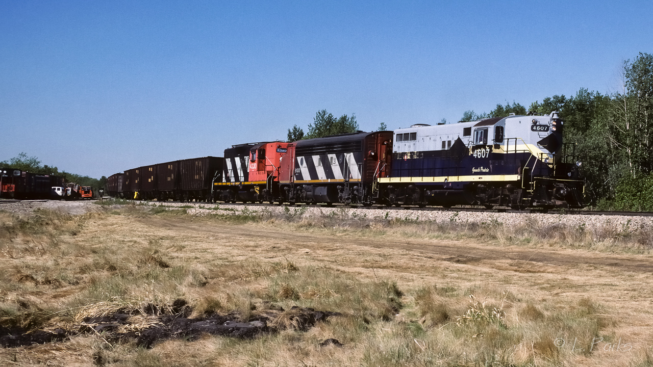 A unit train was just entering the connecting track which will take the empties across Hwy.28 and then connect to the Lac La Biche Sub. From there it is still a long trip north to Waterways. The siding at Kerensky was all a buzz with activity. The 3 tracks (main, siding & elevator) in Redwater were being fluffed and folded, plus the main track from Redwater to Kerensky was receiving the same treatment (new ballast and ties, then leveled). Cab 79420 on the tail end.