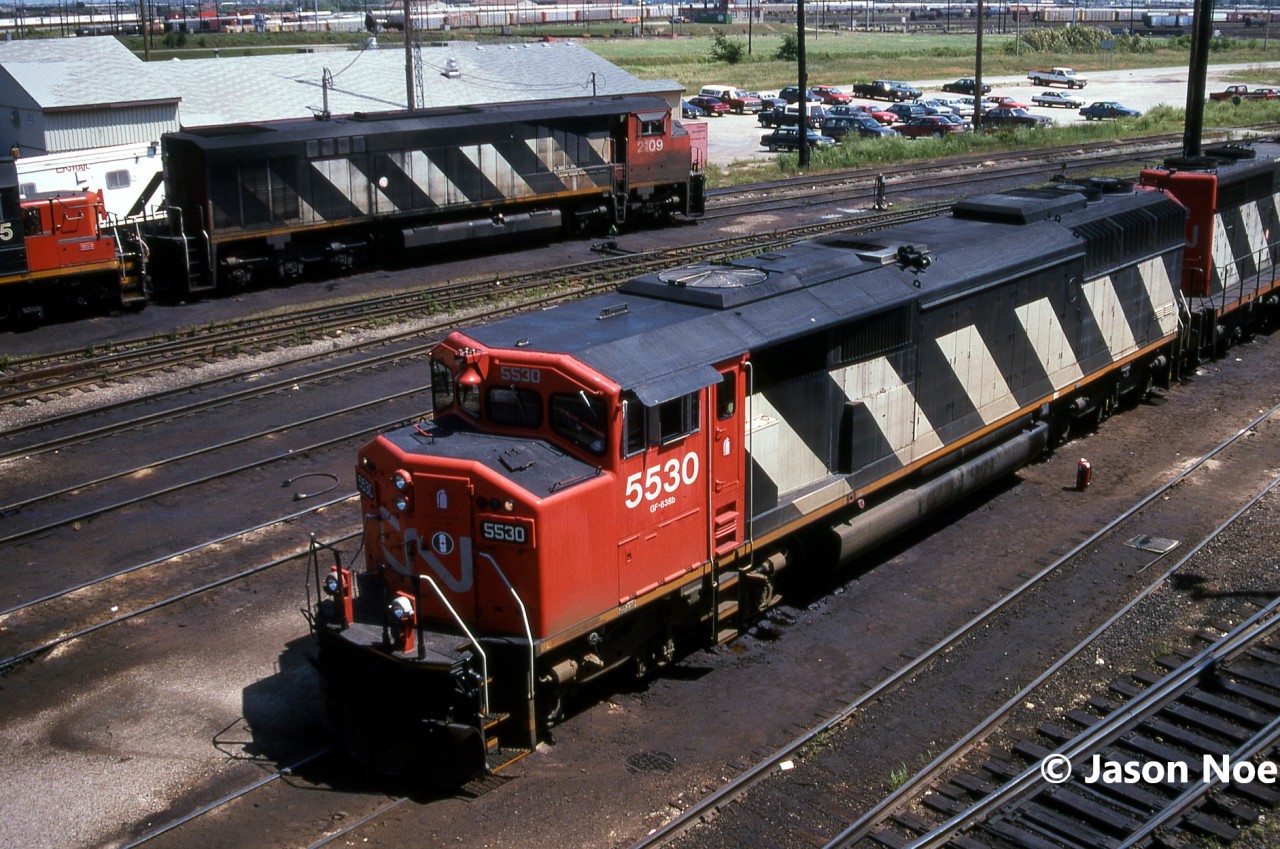 CN SD60F 5530 and SD40 5152 await departure from MacMillan Yard in Vaughn, Ontario likely on a future northbound train on the Bala Subdivision back to Western Canada. In the background is fellow draper taper designed HR616 2109. The view is from the tower located at the MacMillan Yard diesel shop, with thanks to the friendly men who were working in the tower that day.