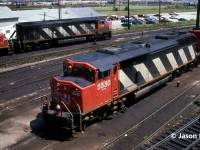 CN SD60F 5530 and SD40 5152 await departure from MacMillan Yard in Vaughn, Ontario likely on a future northbound train on the Bala Subdivision back to Western Canada. In the background is fellow draper taper designed HR616 2109. The view is from the tower located at the MacMillan Yard diesel shop, with thanks to the friendly men who were working in the tower that day. 