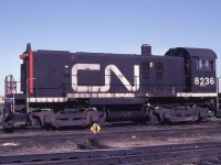 With its stack neatly covered and bell removed, CN S12 8236, class MS-10p, waits the inevitable on a storage track at CN's Toronto Yard on a pleasant May afternoon in 1983. The unit was built by MLW in 1958 and officially retired on October 29, 1982, as being obsolete with only 646,000 miles accumulated. The 25 year old unit still looked pretty good!!!!