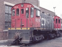 CN 8519 MLW S-13 coach yard switcher is seen taking a break behind the shops in July of 1982. These switchers were once ubiquitous at Toronto Union Station and Spadina Coach Yard, moving passenger car consists around.  Hard to believe you could wander around and take pictures like this back then. Note the journal lids for the old friction bearings.