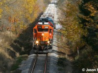 CN L568 with BNSF 2968, CN 7501 and CN 4906 are exiting the town of New Hamburg, Ontario on the Guelph Subdivision heading to Stratford and then to industries further west on the line. 