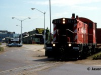 During a sweltering July day, CP SW1200RSm 1270 (ex-CP 8150) works the National Steel Car facility deep in the industrial core of Hamilton, Ontario. CP 1270 was retired in October 2003 and was sold to Rail Trusts Equipment (RTEX). The unit was later resold to the St. Marys Railroad in Georgia and was repainted and renumbered to 506. 
