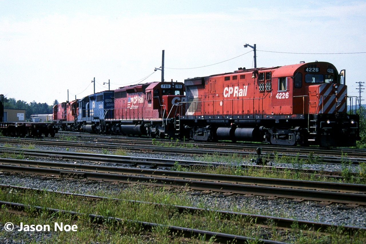 During a scorching August afternoon, a lengthy string of motive power is observed at CP’s Aberdeen Yard in Hamilton, Ontario. The units included; CP C-424 4226, SD40-2 786, Conrail SD40 0809, GP9u 8248 and C-424 4216. SD40 0809 was part of a group of unit’s leased through Conrail at the time to assist CP through their motive power shortage. Other blue SD40’s were leased through Conrail Leasing as well.