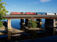 CPKC 231 is crossing the Ottawa River as it approaches Île-Perrot with CP 8156 & CP 8646 for power.