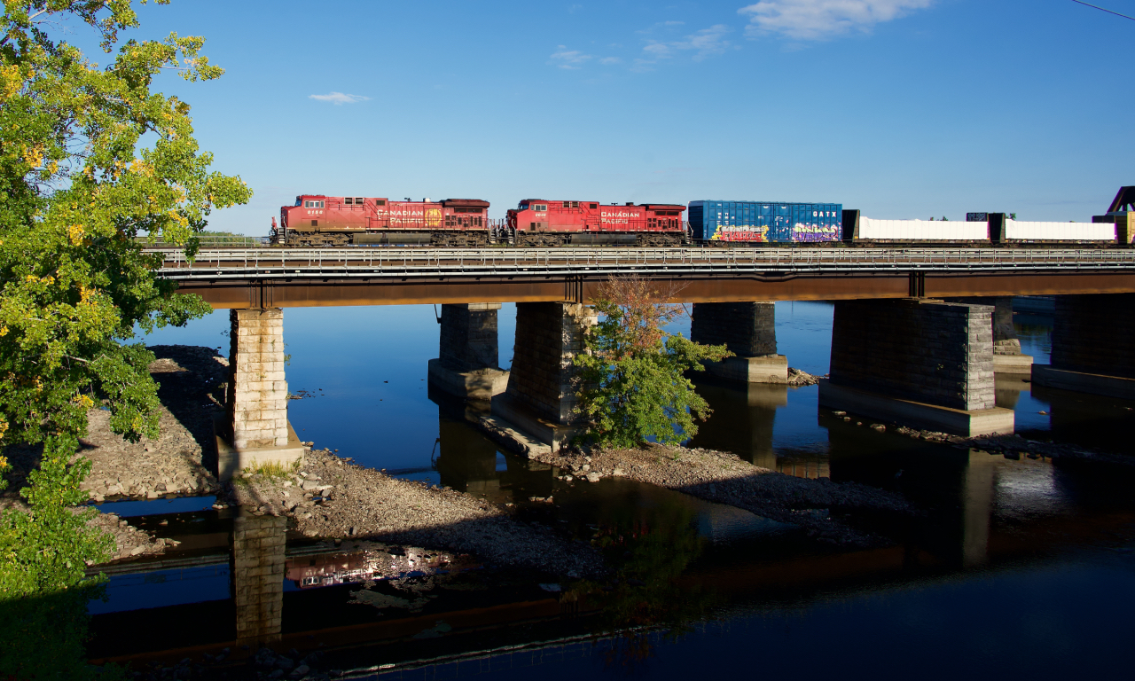 CPKC 231 is crossing the Ottawa River as it approaches Île-Perrot with CP 8156 & CP 8646 for power.