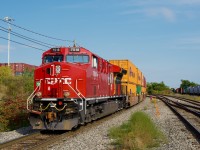 CPKC 119 is backing up towards Lachine IMS Yard as CN 368 passes at right. Fresh CP 7518 is head end power.