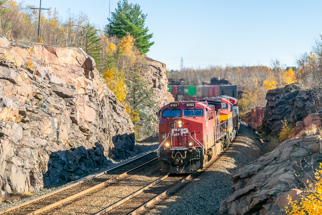 Here's a Sudbury rock cut in the daylight! Six months since the merger, it's become a near-daily occurrence to see CP and KCS power paired up on cross-country intermodals. Under the low autumn sun, CPKC 119 navigates the Sprecher s-bend at a leisurely pace – it first has to let the eastbound Budd car enter the double track at Flanagan, about a mile up the track.