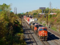 CN 120 is exiting Taschereau Yard with CN 3262, CN 3373 and an unknown ex-CREX unit up front.
