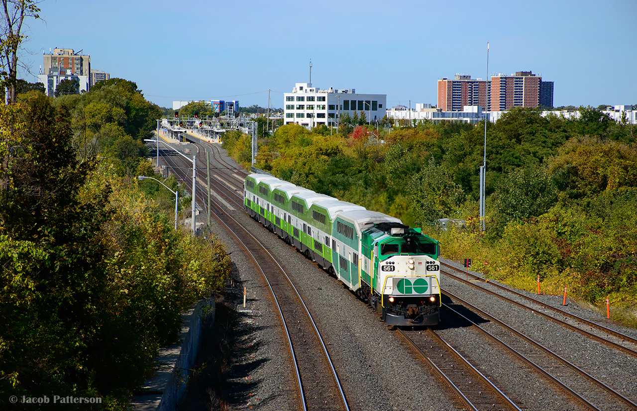 GO 561 leads 3516 from Mount Pleasant - Union through the West Toronto neighbourhood, about to pass under Rogers Road.  In the distance, the new Mount Dennis GO Station can be seen, which when finished, will connect GO and Union Pearson passengers with TTC and Eglinton Crosstown LRT systems.  The large white building at centre is part of the former Kodak plant, located on the northeast side of Eglinton Avenue and Weston Roads, east of the CNR Brampton Sub and CPR Mactier Sub.  Named Kodak Heights, the plant, commencing operation in 1917 as Kodak's Canadian headquarters, was expanded in 1939 when building 9, pictured above, was built.  Operation continued until June 2005, when Kodak ceased its Canadian operations.