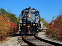 Where electrics once roamed.  GIO's Welland job switches out cars for Ardent Milling, which will be transloaded on the westernmost track at the London Agricultural Commodities elevator <a href=https://www.railpictures.ca/?attachment_id=40980>(the former Robin Hood facility.)</a>  <br><br>Constructed in 1940, the Robin Hood Flour Mill received rail service from the Niagara, St. Catharines & Toronto Railway via a spur from their <a href=https://www.railpictures.ca/?attachment_id=47466>Welland Division mainline</a> on Elm Street.  An electric locomotive was based at the foot of Elm Street in Port Colborne as an outpost assignment, servicing this facility in what was then known as the community of Humberstone, amalgamating with Port Colborne in 1952.  Electric service on the NS&T ceased in 1960, with CNR diesels taking over the assignment.  The yard pictured contained only the main and east siding at the time, while over on Elm Street, a short stretch of the old NS&T main was kept south of Barrick Road for switching purposes.  This arrangement remained until the <a href=https://www.railpictures.ca/?attachment_id=27684>connection at the north end of the elevator</a> was constructed in 1983-1984 to the Canal Sub.  Per Paul Duncan, this connection appears to have been the CN Casco Lead until being handed off to the Port Colborne Harbour Railway.  The connection <a href=https://www.railpictures.ca/?attachment_id=8122>south to the former Dunnville Sub</a> would be built in 1997 with startup of PCHR operations.  <br><br>The Robin Hood Flour Mill would be closed in 2008 by Horizon Milling, and later sold to Ceres Global Ag in 2010 to be used primarily for grain storage and export.  Space in the elevator would be leased to London Agricultural Commodities effective 2019, with LAC purchasing the facility in 2023.  Shortly before the end of NS&T electric operations, this unit was built.  Rolling out of GMDD London in 1955 as CNR 2013, this GP9 would be renumbered in 1956 to CN 4464.  In 1986, it would be rebuilt as GP9RM 7224, and sold to Lambton Diesel Services in 2021.  <br><br>Looking at 1930s aerial imagery, this site can be seen prior to the elevator's construction.  Steve Host's recent research pointed out the abandoned right of way from the Welland Ship Canal Construction Railway.  It would appear just north of the elevator location was a dump site for earth and other construction debris, and the construction "mainline" cut across the canal near this location.  Comparing 1930s and 1940s imagery, one can see this track runs along the former construction railway right of way from the point where 7224 is seen above, right to the elevator silos.