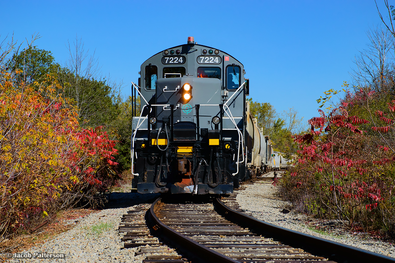 Where electrics once roamed. GIO's Welland job switches out cars for Ardent Milling, which will be transloaded on the westernmost track at the London Agricultural Commodities elevator (the former Robin Hood facility.) Constructed in 1940, the Robin Hood Flour Mill received rail service from the Niagara, St. Catharines & Toronto Railway via a spur from their Welland Division mainline on Elm Street. An electric locomotive was based at the foot of Elm Street in Port Colborne as an outpost assignment, servicing this facility in what was then known as the community of Humberstone, amalgamating with Port Colborne in 1952. Electric service on the NS&T ceased in 1960, with CNR diesels taking over the assignment. The yard pictured contained only the main and east siding at the time, while over on Elm Street, a short stretch of the old NS&T main was kept south of Barrick Road for switching purposes. This arrangement remained until the connection at the north end of the elevator was constructed in 1983-1984 to the Canal Sub. Per Paul Duncan, this connection appears to have been the CN Casco Lead until being handed off to the Port Colborne Harbour Railway. The connection south to the former Dunnville Sub would be built in 1997 with startup of PCHR operations. The Robin Hood Flour Mill would be closed in 2008 by Horizon Milling, and later sold to Ceres Global Ag in 2010 to be used primarily for grain storage and export. Space in the elevator would be leased to London Agricultural Commodities effective 2019, with LAC purchasing the facility in 2023. Shortly before the end of NS&T electric operations, this unit was built. Rolling out of GMDD London in 1955 as CNR 2013, this GP9 would be renumbered in 1956 to CN 4464. In 1986, it would be rebuilt as GP9RM 7224, and sold to Lambton Diesel Services in 2021. Looking at 1930s aerial imagery, this site can be seen prior to the elevator's construction. Steve Host's recent research pointed out the abandoned right of way from the Welland Ship Canal Construction Railway. It would appear just north of the elevator location was a dump site for earth and other construction debris, and the construction "mainline" cut across the canal near this location. Comparing 1930s and 1940s imagery, one can see this track runs along the former construction railway right of way from the point where 7224 is seen above, right to the elevator silos.