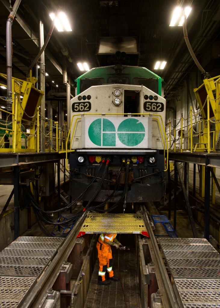As part of the Real Rails Convention in Burlington, I along with 38 other railfans got a tour of GO Transit's Willowbrook Yard. Thanks to the convention organizers for putting this together and to GO Transit for showing us around.
 Here an employee is seen under F59PH GOT 562.