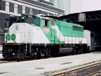 On a hot hazy summer day in August of 1983, a westbound GO Transit commuter train is seen at the west end of Toronto Union Station on track 3.