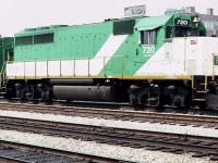GO Transit 720 leads an eastbound inbound commuter train towards Toronto Union Station in August of 1983. This unit was a rebuilt EMD GP-40 classified as a GP-40-2M